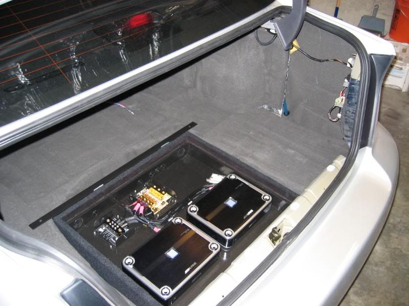 FSWA Custom amp rack to fit in spare tire well Keeps spare! Subaru